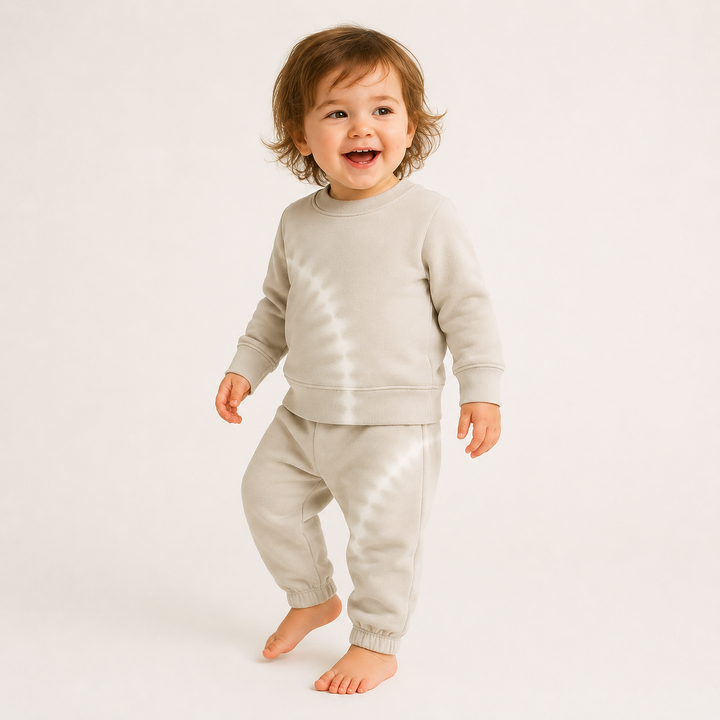 Toddler wearing PAIGELAUREN Bone Tie Dye Fleece Sweatshirt and Sweatpant Set