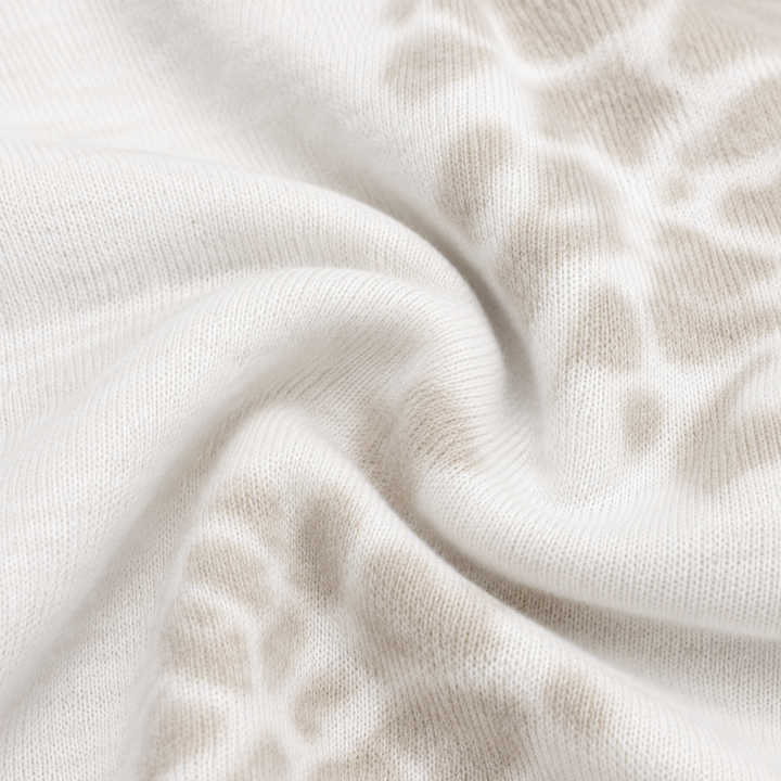 Close-up of PAIGELAUREN Bone and White tie dye ribbed fabric