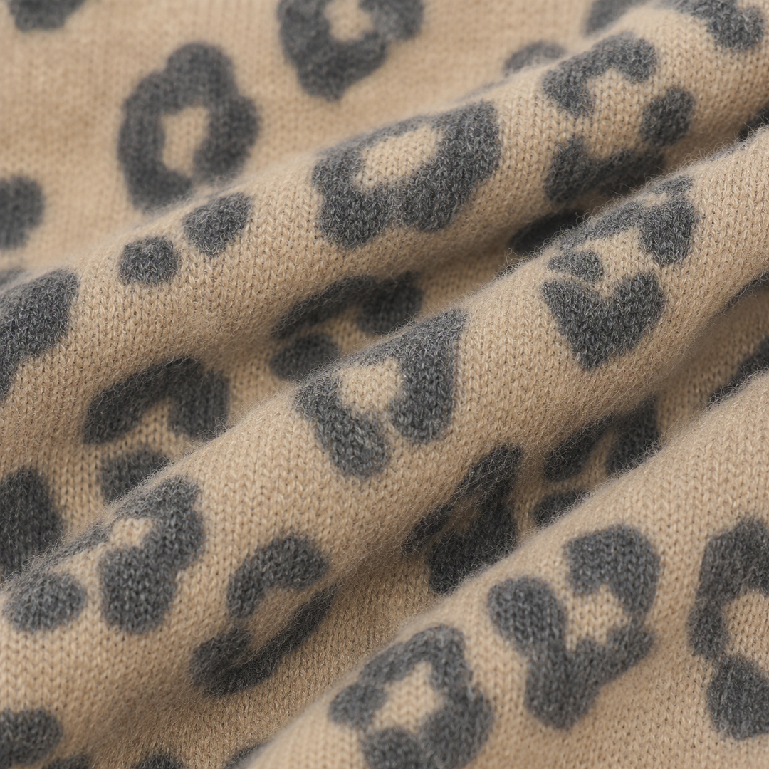 Close-up of ultra-soft brushed hacci animal print fabric in Black and Taupe