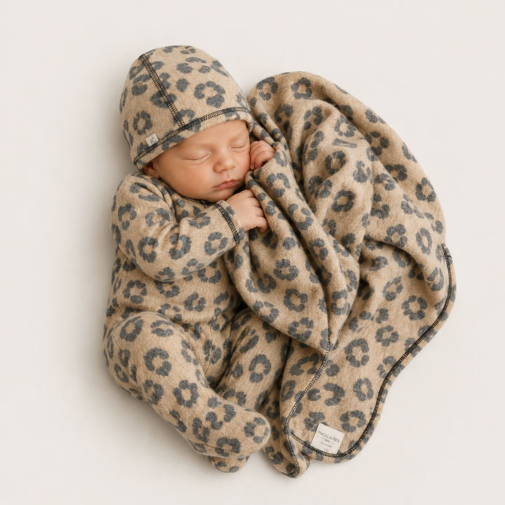 Newborn wearing PAIGELAUREN Black and Taupe Brushed Hacci Animal Romper and beanie with matching blanket