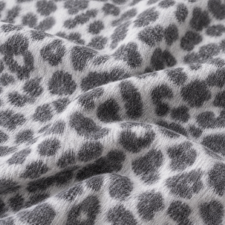 Close-up of PAIGELAUREN Black and White Brushed Hacci animal print fabric
