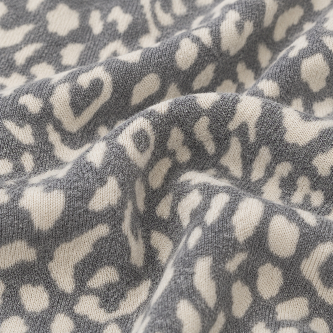 Close-up of PAIGELAUREN Gray and Cream Brushed Hacci animal print fabric