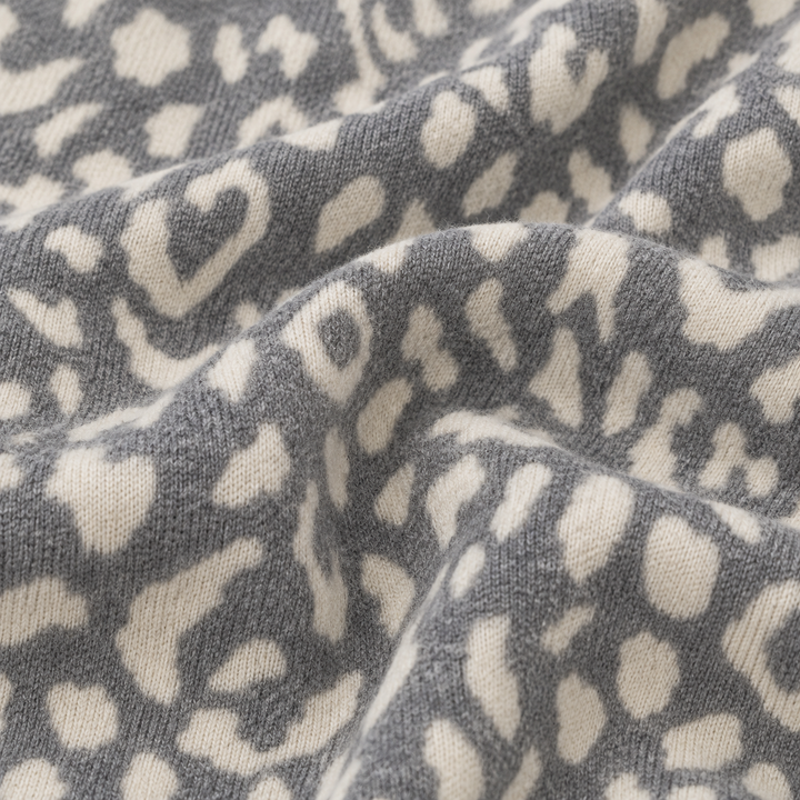 Close-up of PAIGELAUREN Gray and Cream Brushed Hacci animal print fabric