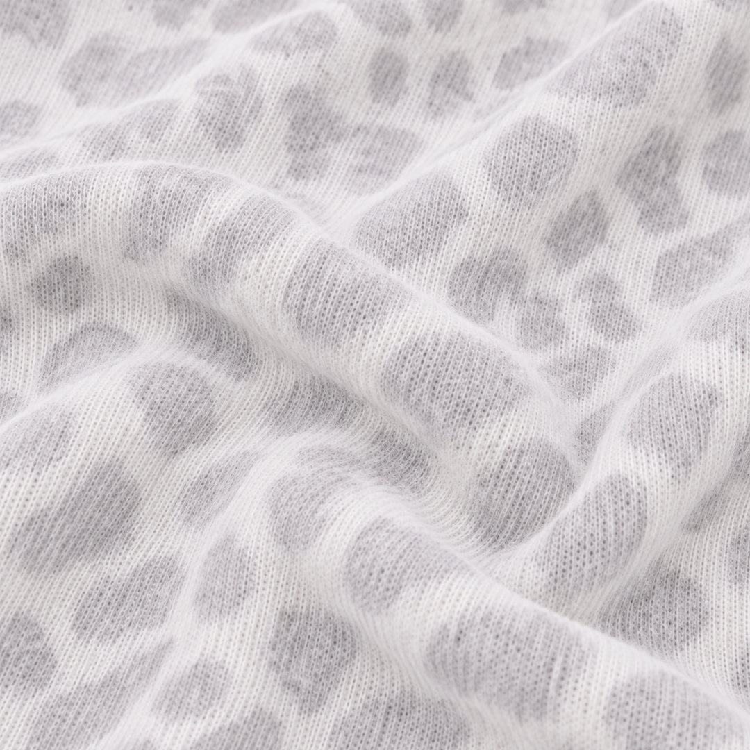 Close-up of PAIGELAUREN Gray and White Brushed Hacci animal print fabric