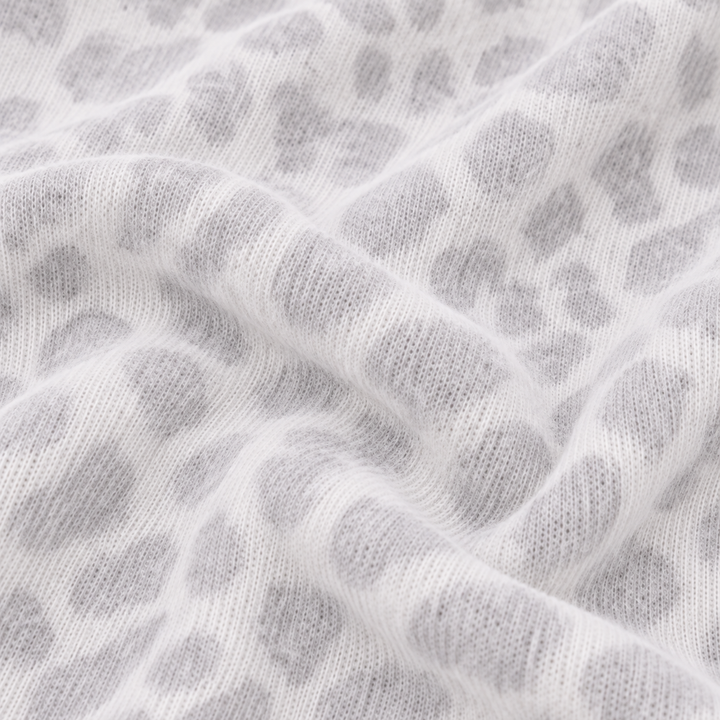 Close-up of PAIGELAUREN Gray and White Brushed Hacci animal print fabric