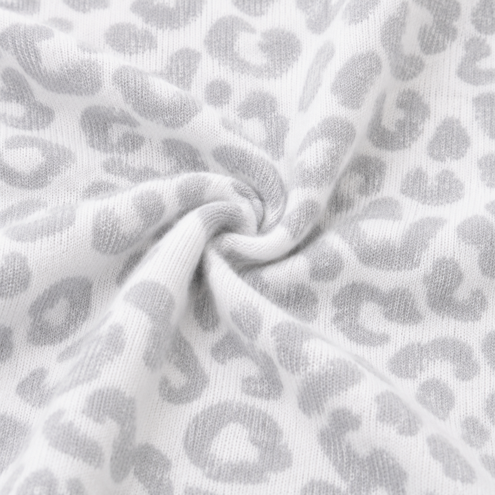 Close-up of ultra-soft brushed hacci animal print fabric in Gray and White