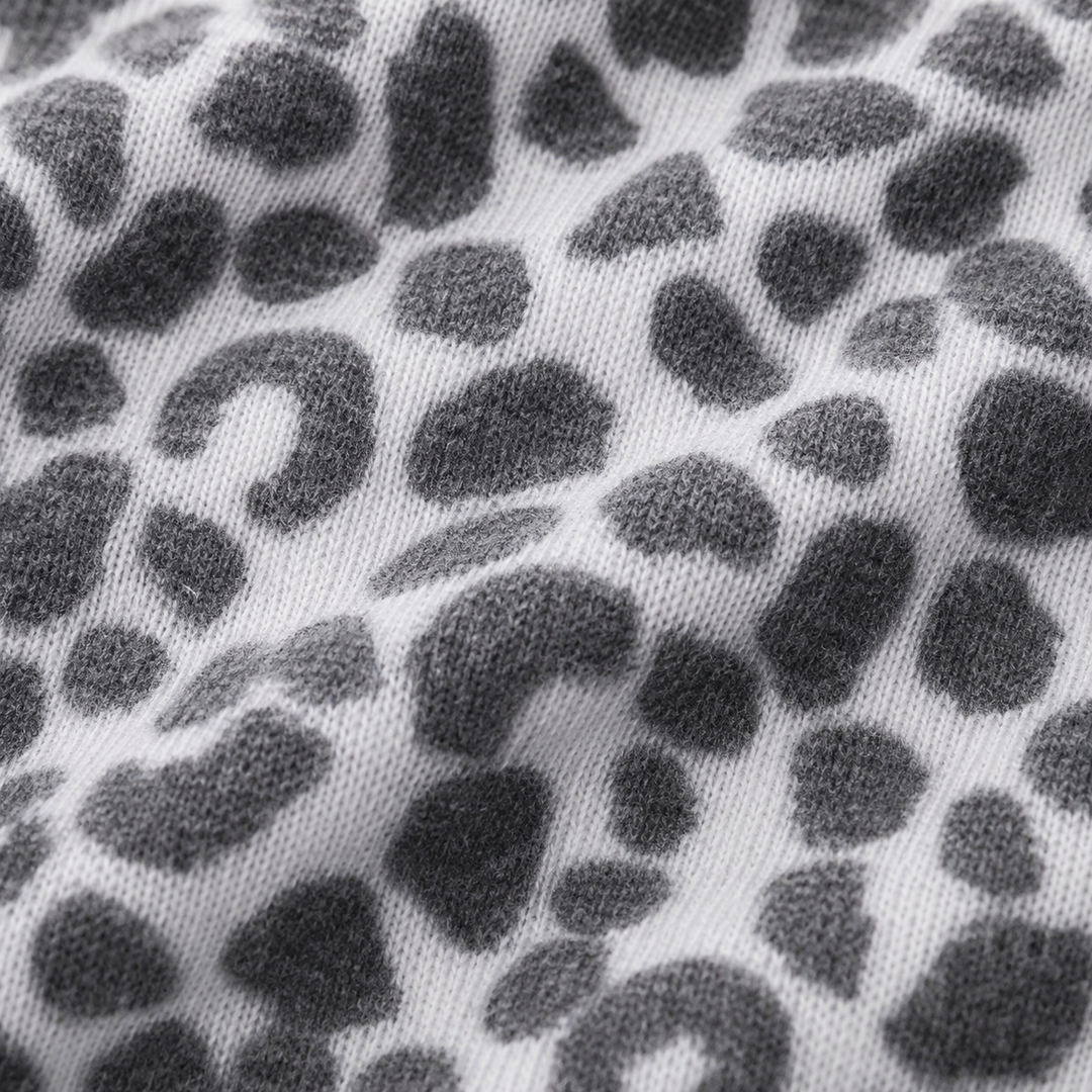 Close-up of ultra-soft black and white animal print brushed hacci fabric by PAIGELAUREN