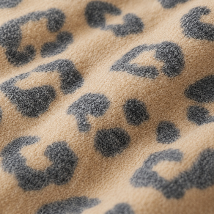 Close-up of soft camel and charcoal animal print brushed hacci fabric by PAIGELAUREN