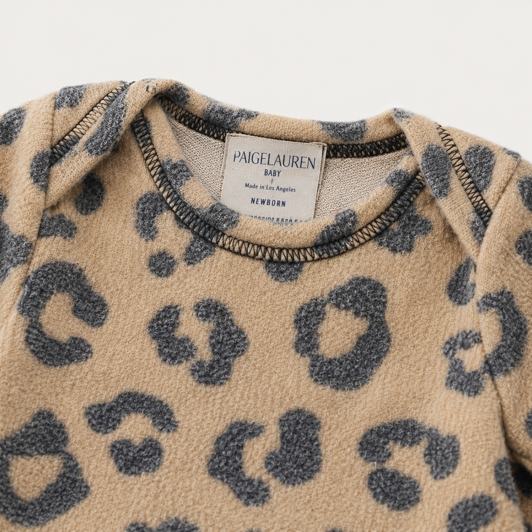 Neckline and label detail of PAIGELAUREN camel Brushed Hacci Animal Pajama