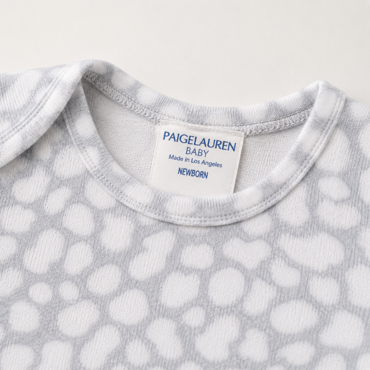 Neckline detail of PAIGELAUREN gray Brushed Hacci Animal Pajama with lap shoulder and neck label