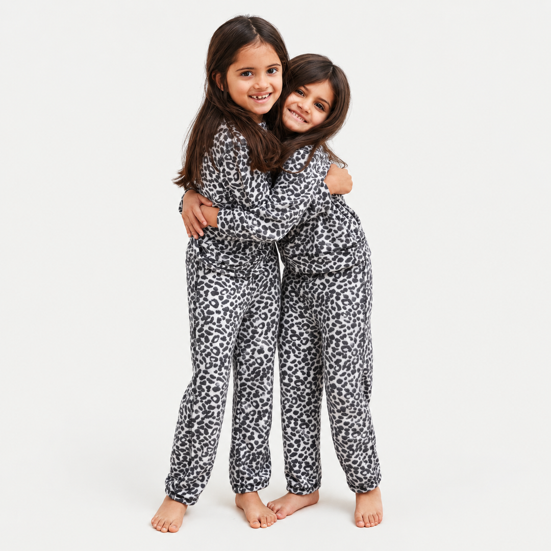 Children wearing PAIGELAUREN Black and White Brushed Hacci Animal Pullover and Pant Set