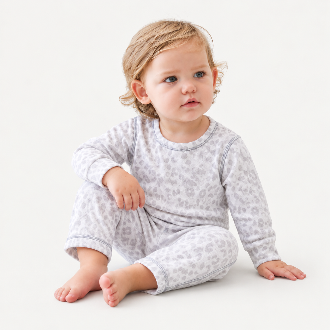 Baby wearing PAIGELAUREN Gray and White Brushed Hacci Animal Pullover and Pant Set