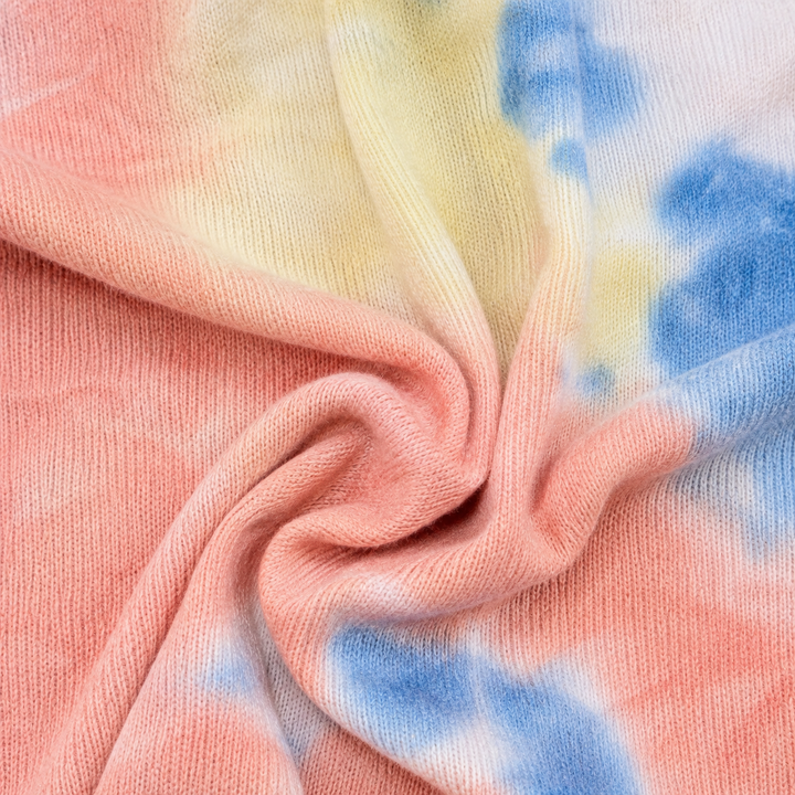 Close-up of the brushed Hacci knit with a soft, cashmere-like texture and multi tie dye finish.