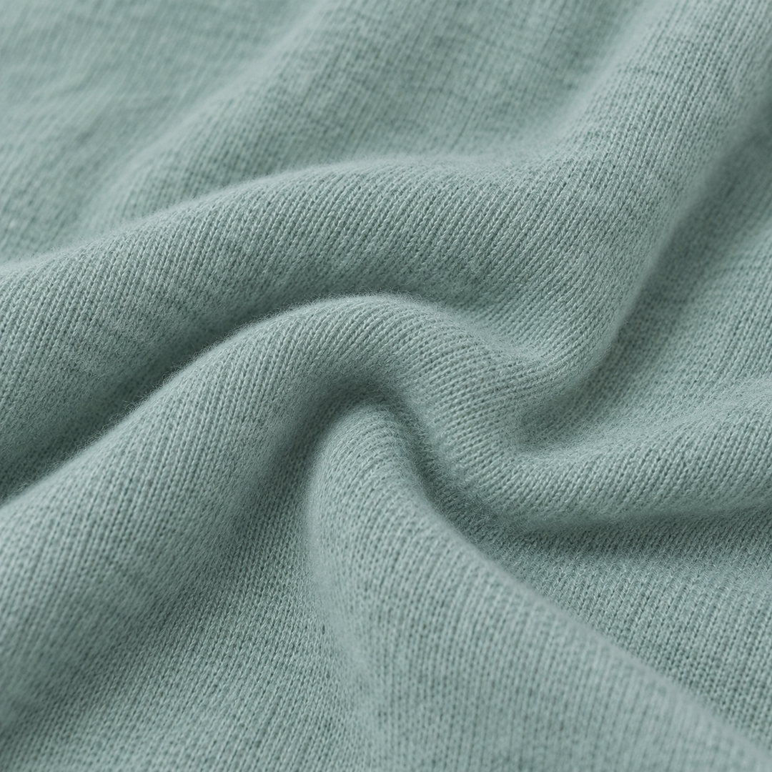 Close-up of soft Seafoam Green PAIGELAUREN brushed hacci fabric texture