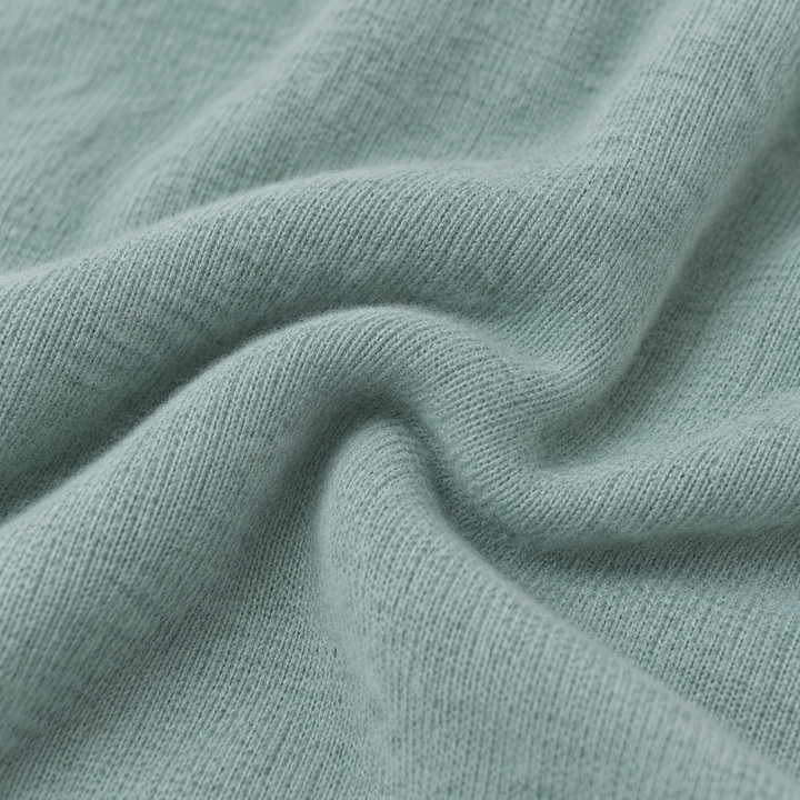Close-up of soft Seafoam Green PAIGELAUREN brushed hacci fabric texture