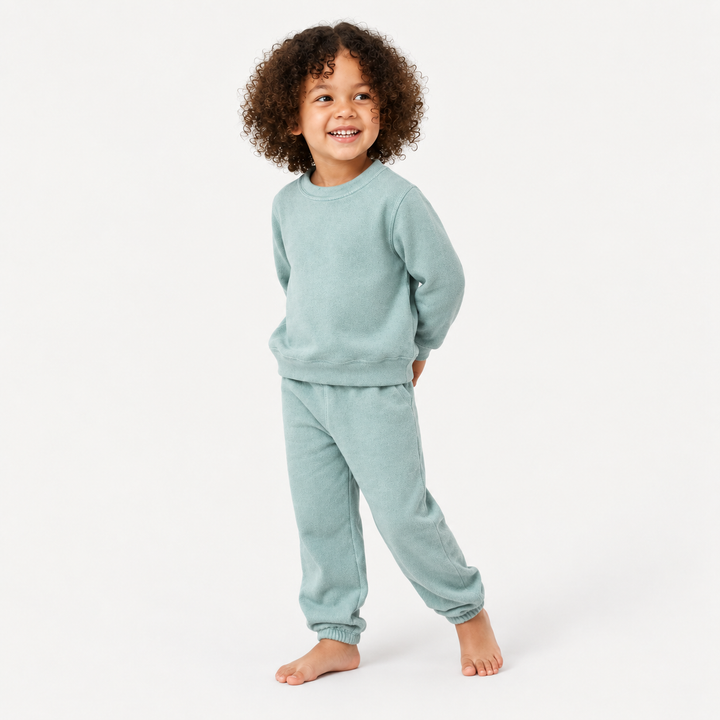 Child wearing PAIGELAUREN Seafoam Green Brushed Hacci Pullover and Pant Loungewear Set