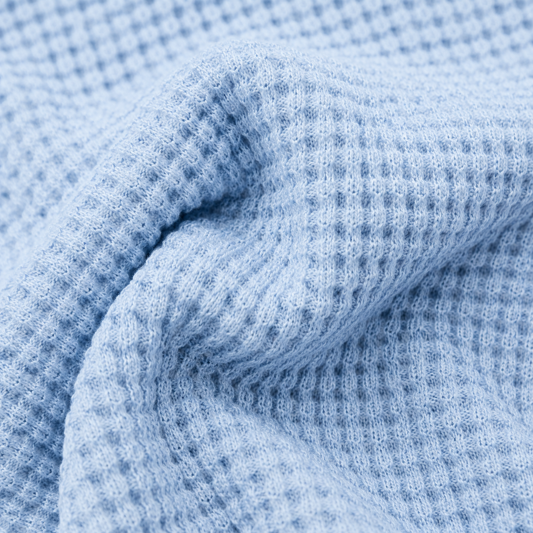 Close-up of Powder Blue chunky thermal waffle knit fabric by PAIGELAUREN