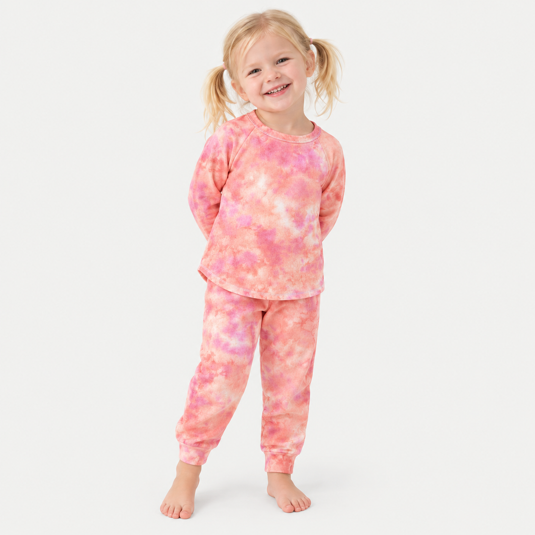 Child wearing PAIGELAUREN coral pink French terry raglan tee and jogger