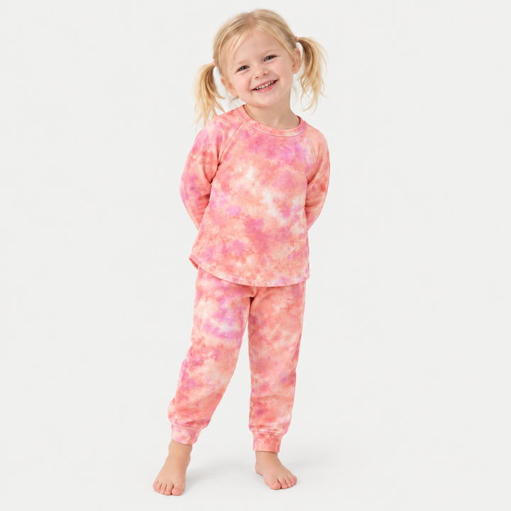 Child wearing PAIGELAUREN coral pink French terry raglan tee and jogger