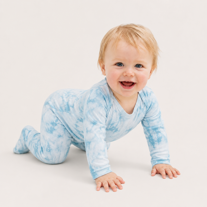 Baby crawling in PAIGELAUREN Aqua Crystal Rib Footie Pajama