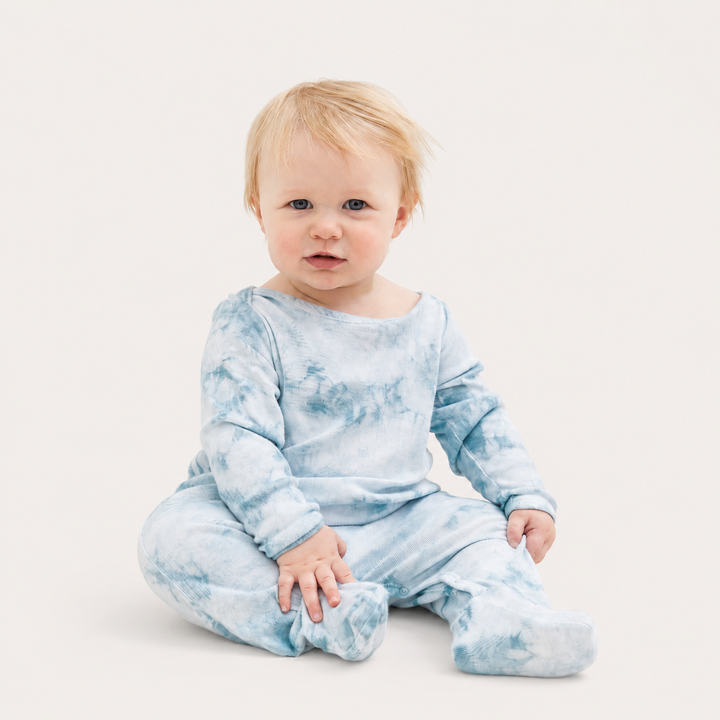 Baby wearing PAIGELAUREN Crystal Rib Footie Pajama in Aqua Crystal