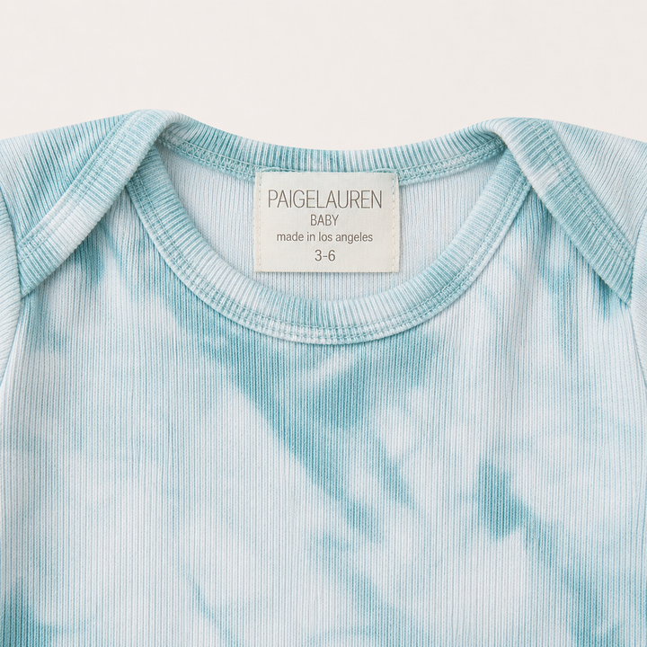 Lap shoulder neckline detail on PAIGELAUREN Aqua Crystal Rib Footie Pajama