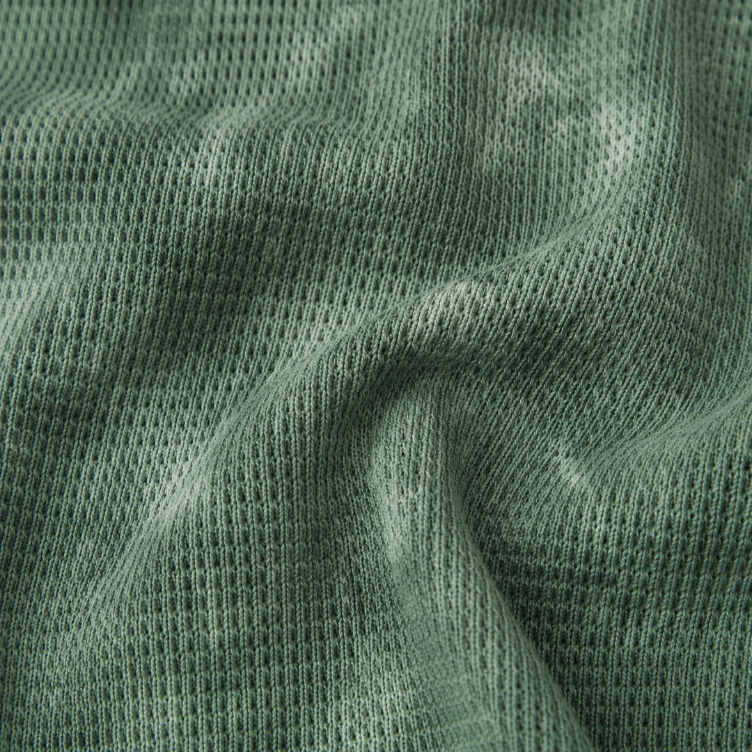 Close-up of PAIGELAUREN Dark Hunter Green hand-dyed thermal knit fabric texture