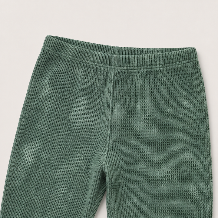 Dark Hunter Green Marble Thermal legging detail showing hand-marble dye, thermal texture and ribbed cuff