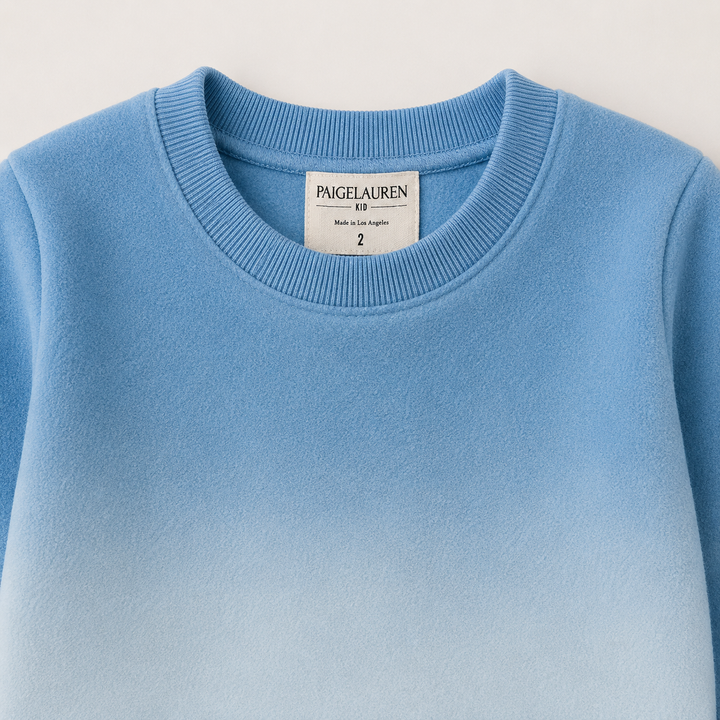 Close-up of PAIGELAUREN Ombre Blue fleece sweatshirt ribbed neckline and label