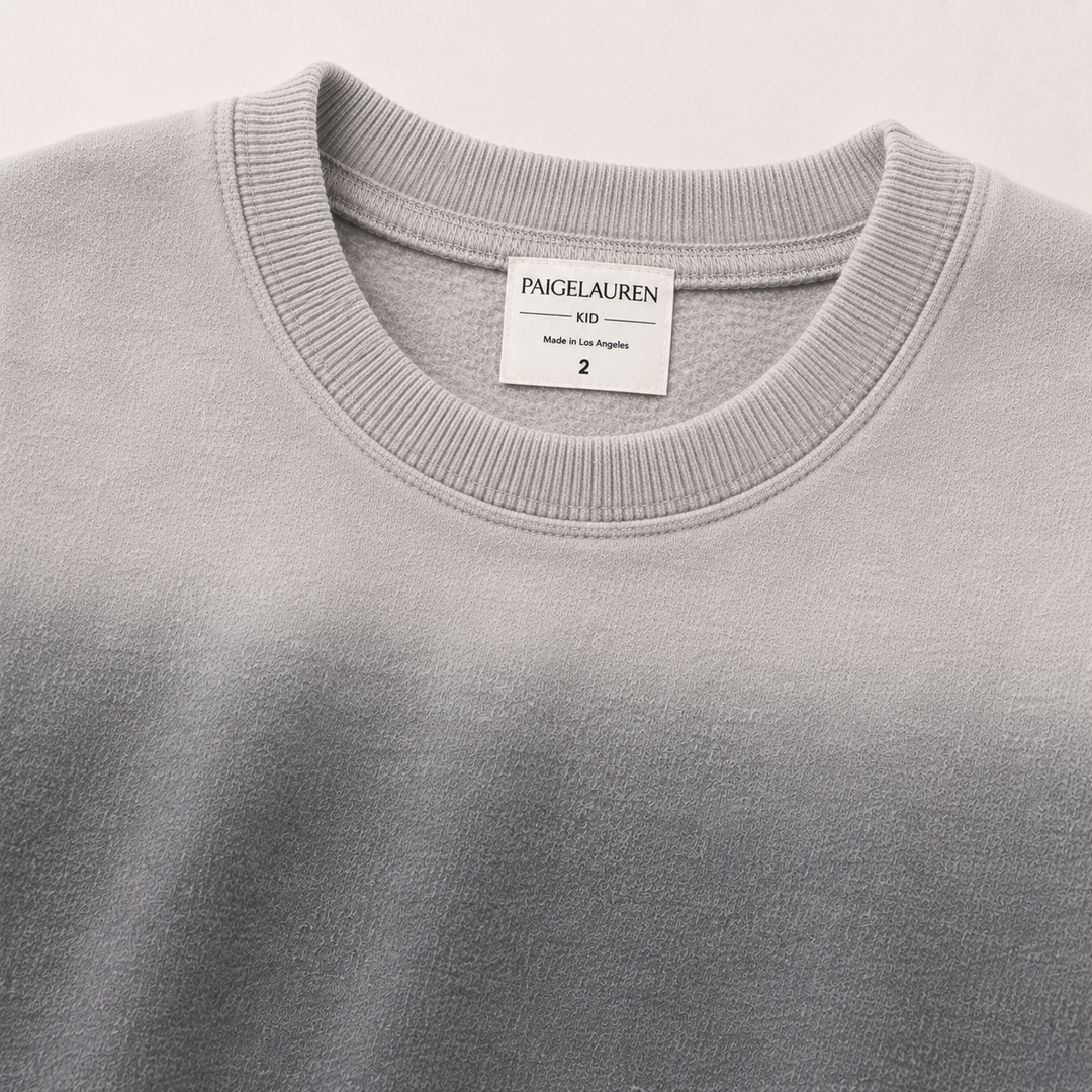 Close-up of PAIGELAUREN Ombre Gray fleece sweatshirt ribbed neckline and label
