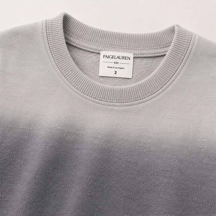 Close-up of PAIGELAUREN Ombre Gray fleece sweatshirt ribbed neckline and label