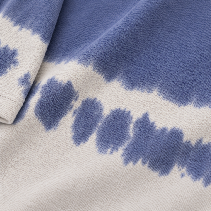 Close-up of PAIGELAUREN Navy Tie Dye fleece fabric and hand-dyed detail