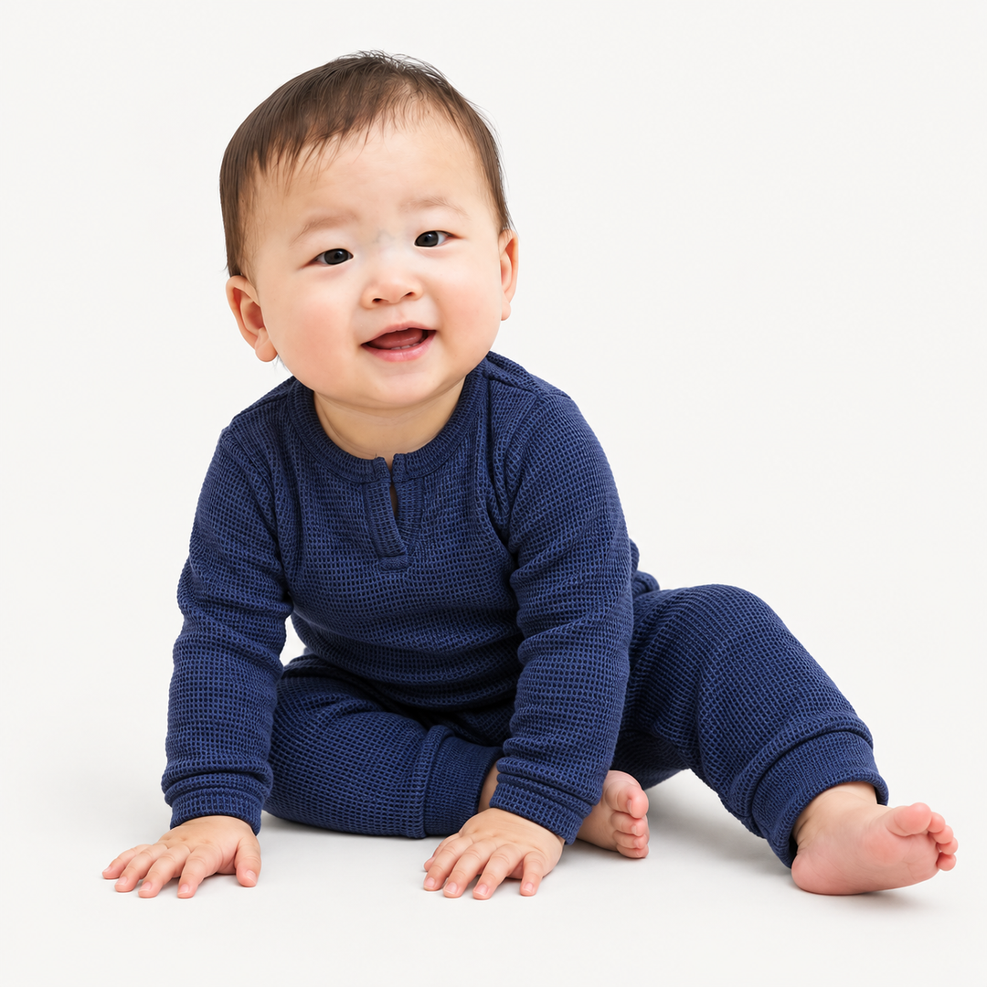 Baby wearing PAIGELAUREN Navy Garment Dyed Thermal Henley Tee and Legging Set