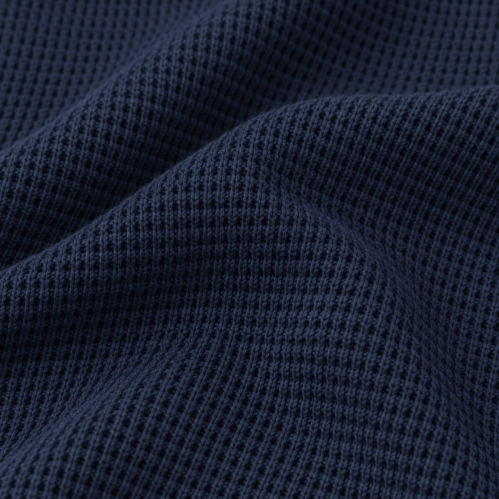 Close-up of PAIGELAUREN Navy garment-dyed thermal fabric texture