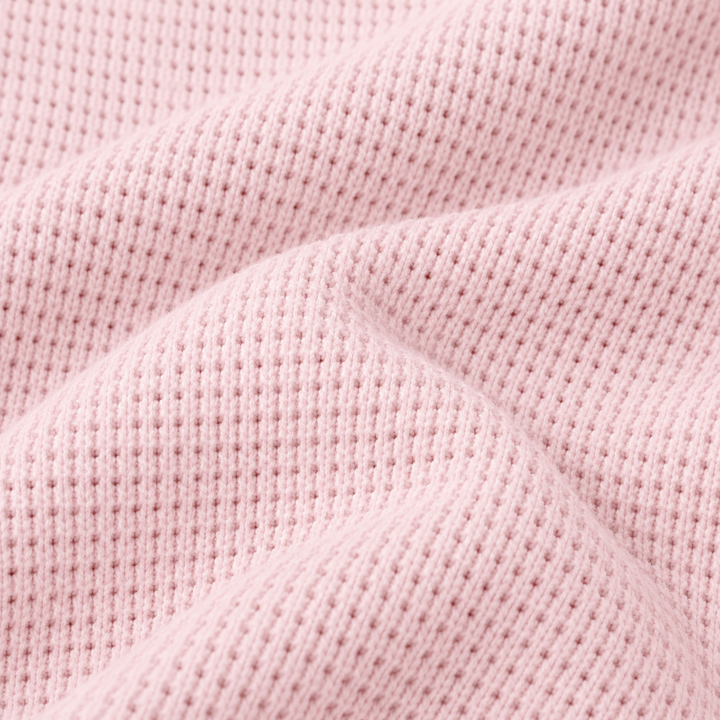 Close-up of PAIGELAUREN Pink garment-dyed thermal fabric texture