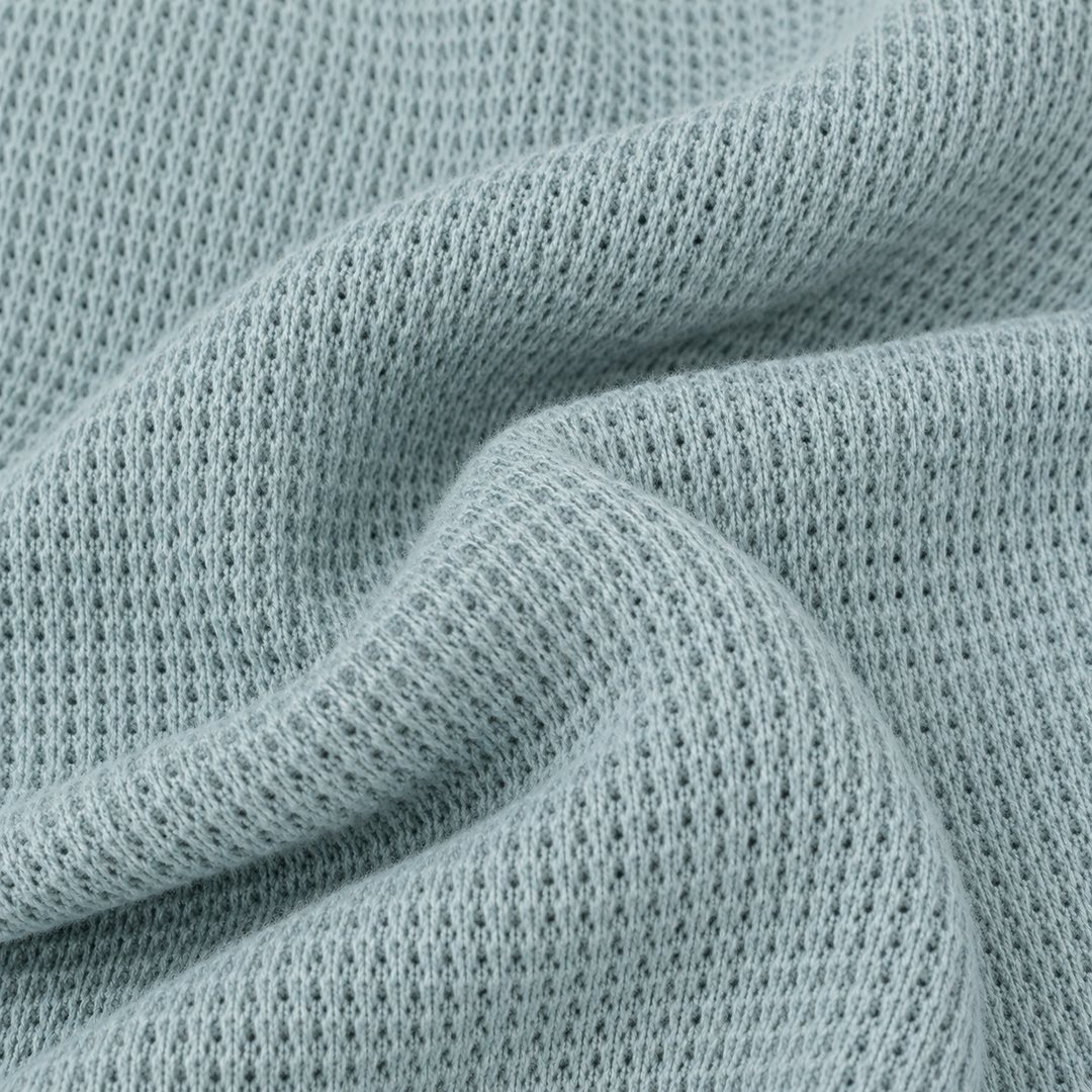 Close-up of PAIGELAUREN Sage garment-dyed thermal fabric texture