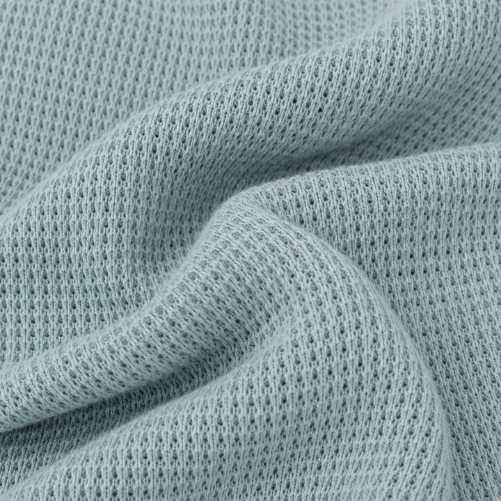 Close-up of PAIGELAUREN Sage garment-dyed thermal fabric texture