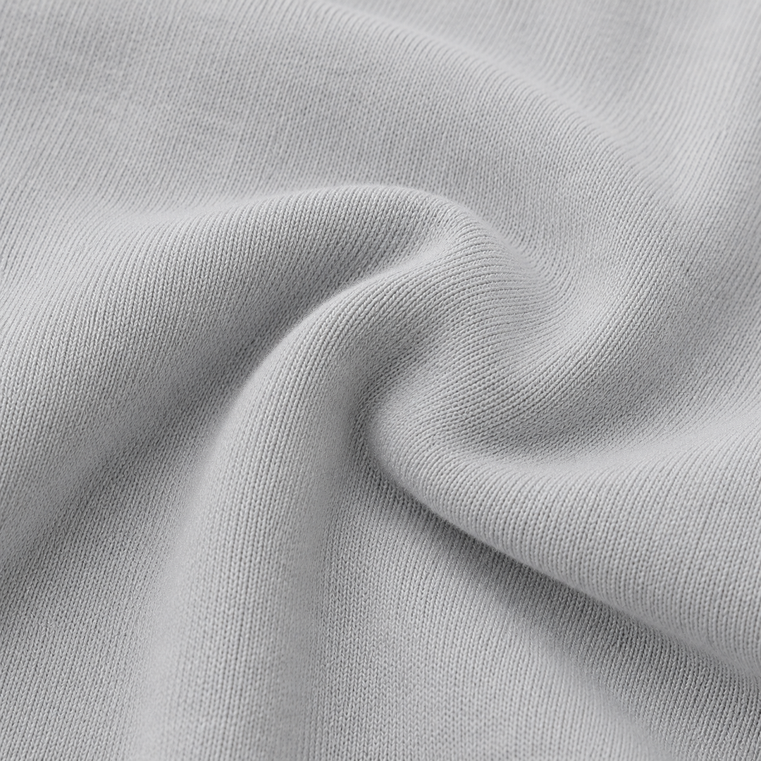 Close-up of soft PAIGELAUREN Gray Fleece fabric showing its cozy knit texture