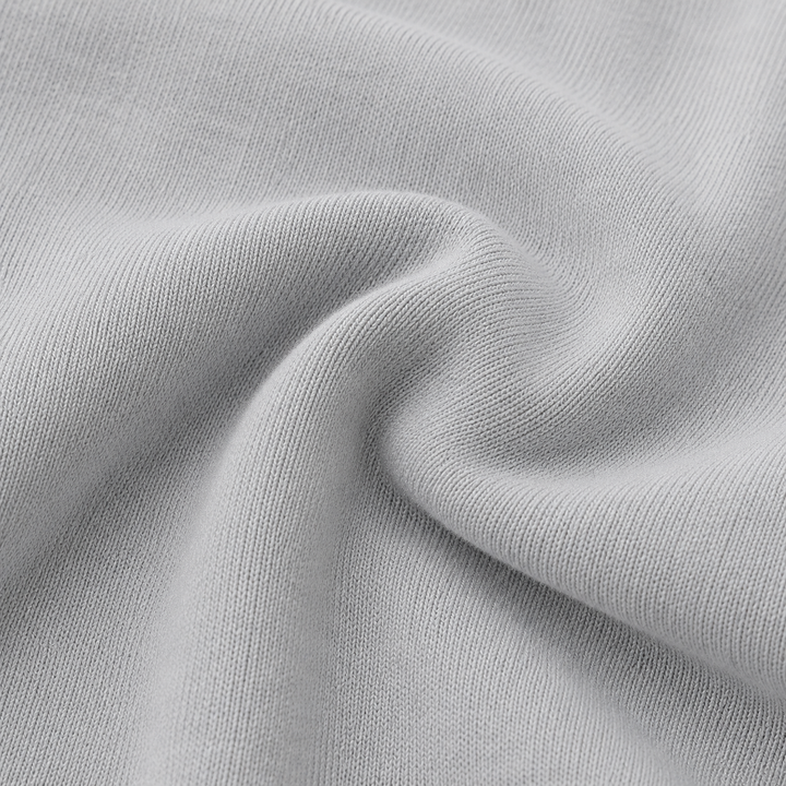 Close-up of soft PAIGELAUREN Gray Fleece fabric showing its cozy knit texture