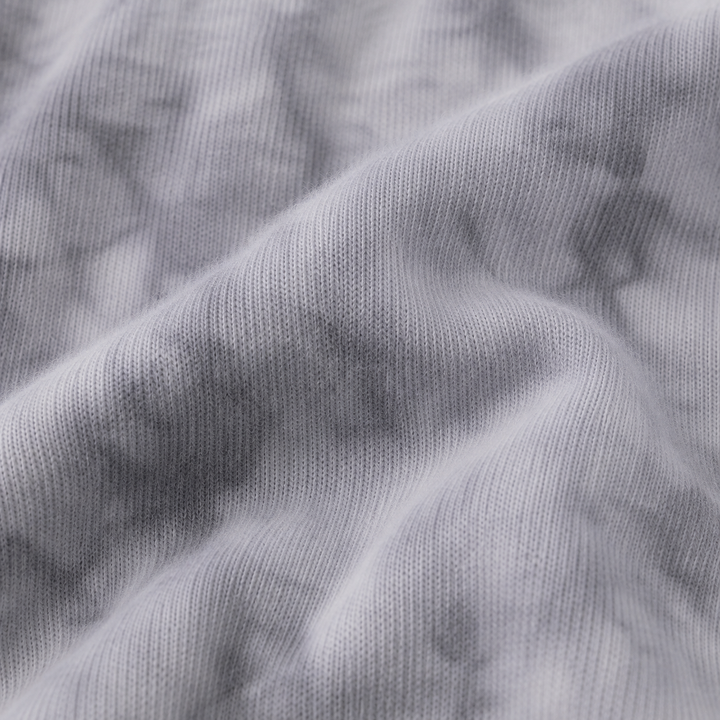Close-up of ultra-soft Gray Marble brushed hacci fabric showing its fuzzy texture and tonal dye