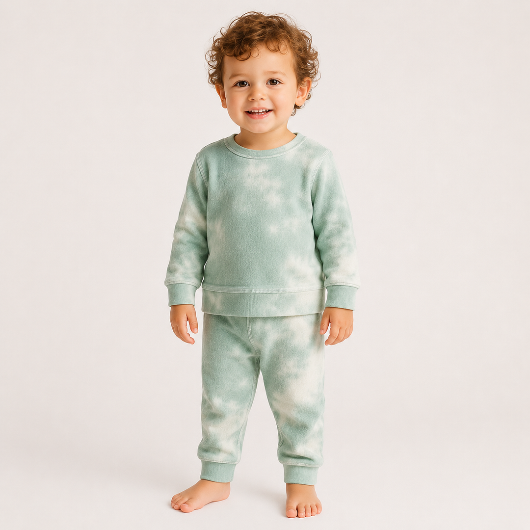 Toddler modeling the PAIGELAUREN Brushed Hacci Green Tie Dye Pullover and Pant Set