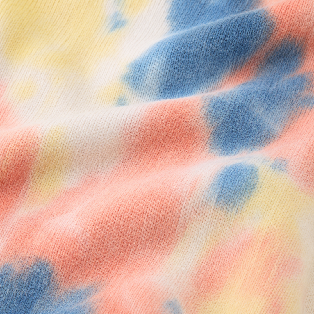 Close-up of soft fuzzy PAIGELAUREN Brushed Hacci Multi Tie Dye fabric