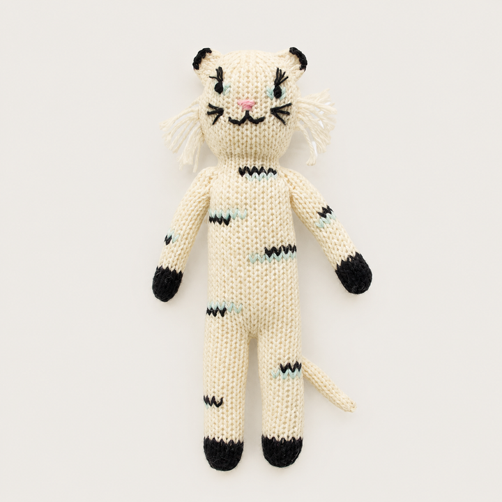 Hand knit cat baby toy in cream with embroidered face and mint details
