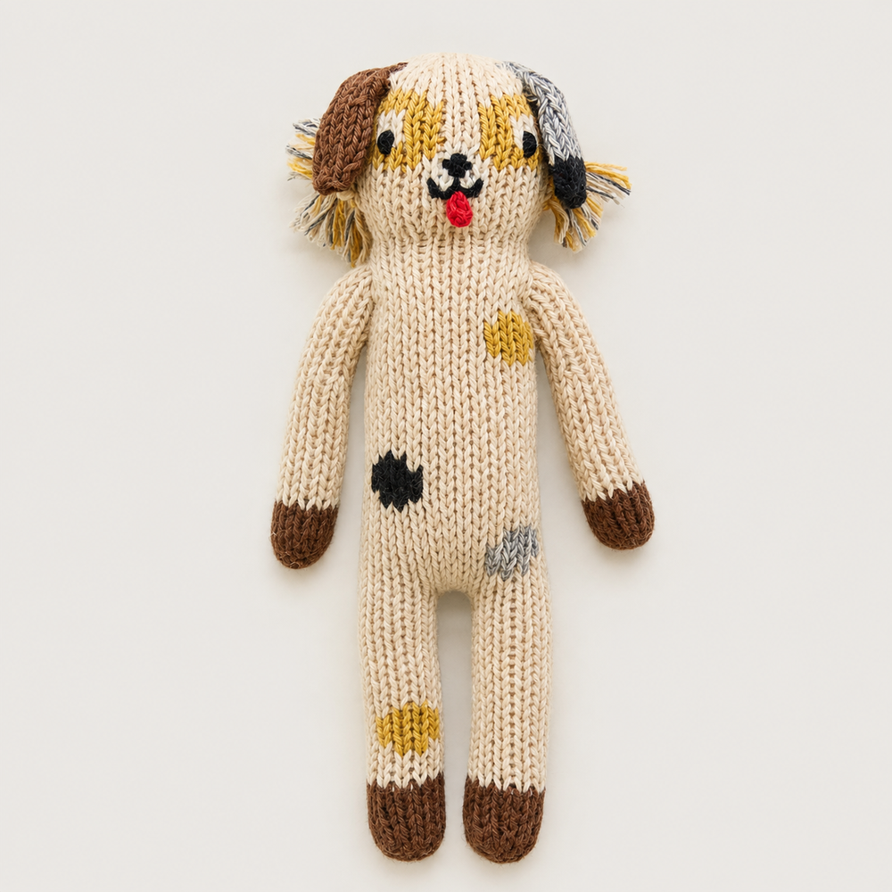 Hand knit dog baby toy in cream with colorful patch details