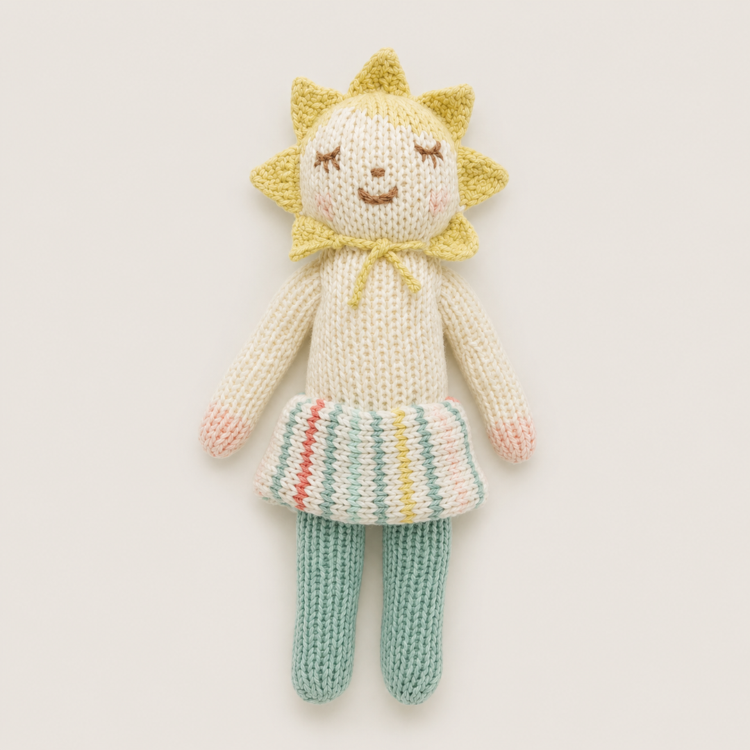 Hand knit sunshine doll baby toy with yellow sun bonnet, pastel striped skirt and mint legs