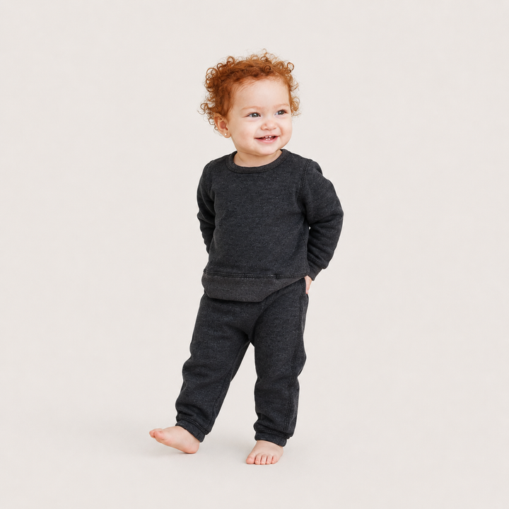 Baby wearing PAIGELAUREN Heathered Black Fleece Sweatshirt and Pant Set
