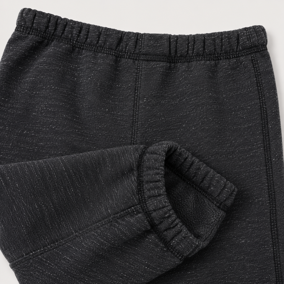 Close-up of PAIGELAUREN Heathered Black Triblend fleece pant with tonal topstitching