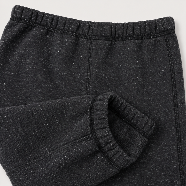 Close-up of PAIGELAUREN Heathered Black Triblend fleece pant with tonal topstitching