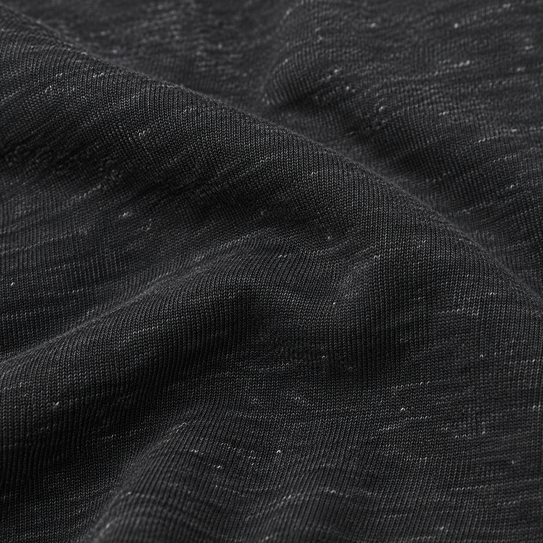 Close-up of PAIGELAUREN Heathered Black tri-blend fleece fabric