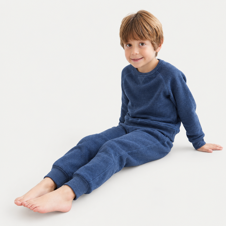 Toddler wearing PAIGELAUREN Heathered Blue Vintage Sherpa Sweatshirt and Sweatpant Set